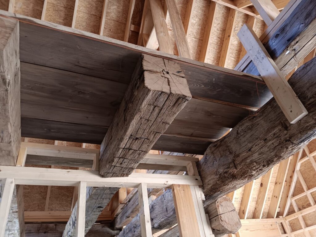 Wooden beams in rustic ceiling construction.