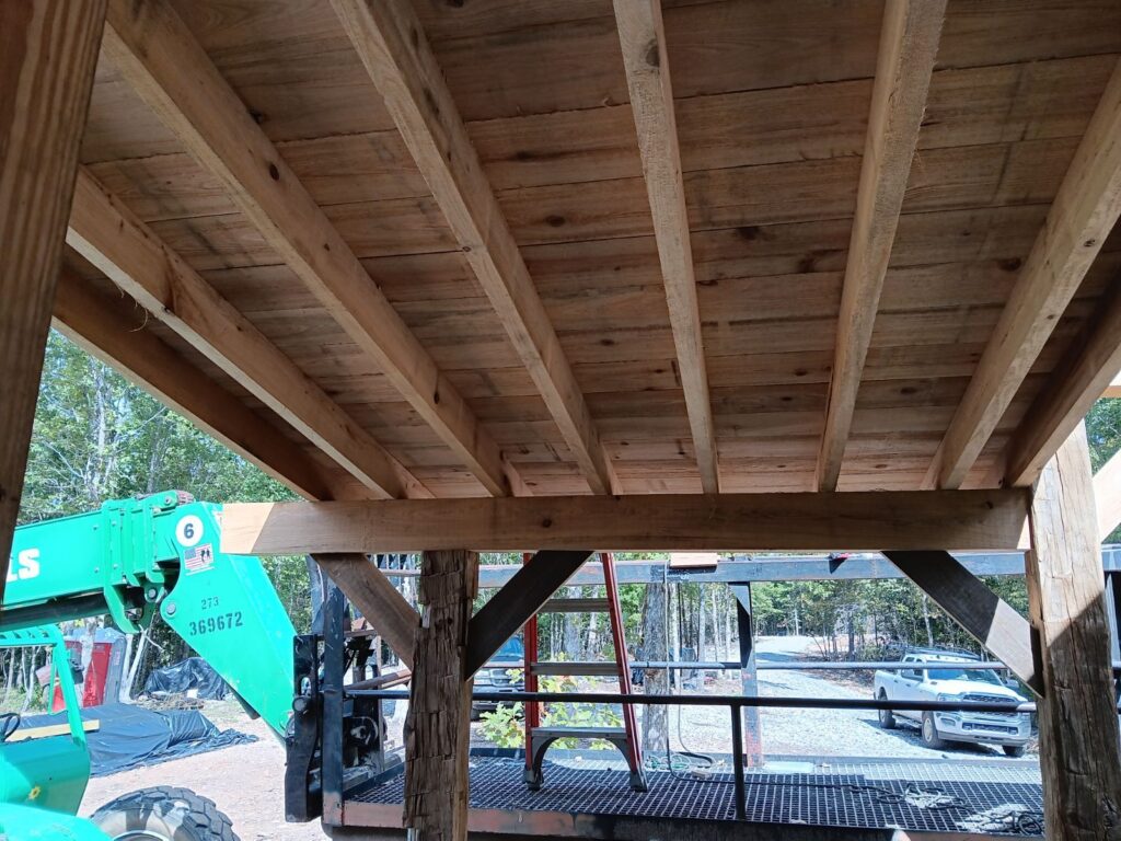 Wooden ceiling with outdoor construction view.