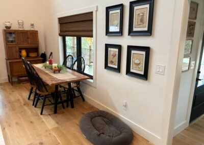 Cozy dining area with wooden table and decorations.