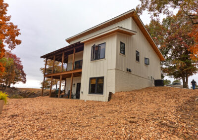 Modern house with wooded landscape in autumn