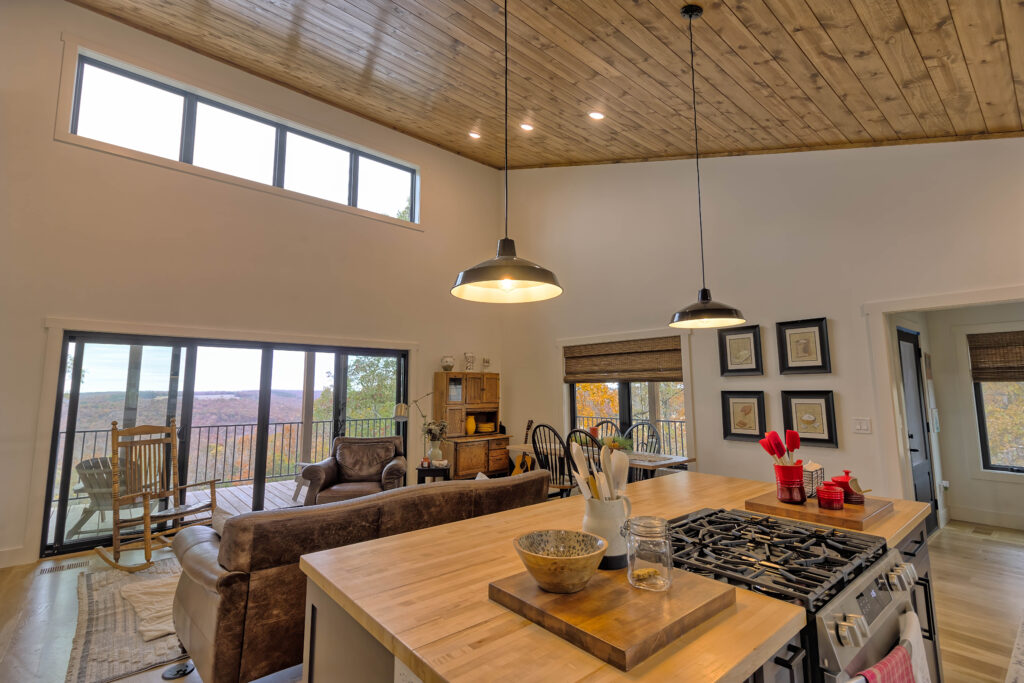 Cozy open-plan kitchen and living room with view.