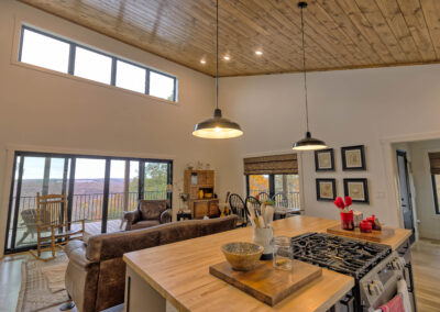 Cozy open-plan kitchen and living room with view.