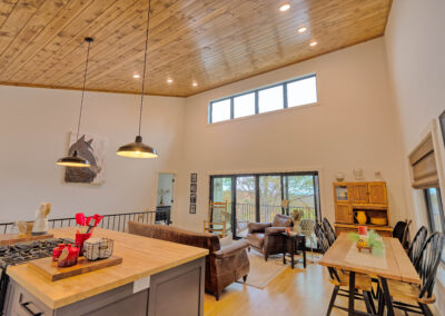 Spacious kitchen and living area with natural lighting.