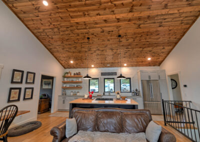 Modern kitchen with wooden ceiling and island.