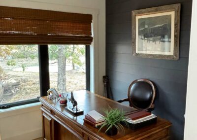 Home office with wooden desk and chair.