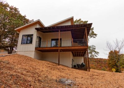 Modern house with wooden deck on hill